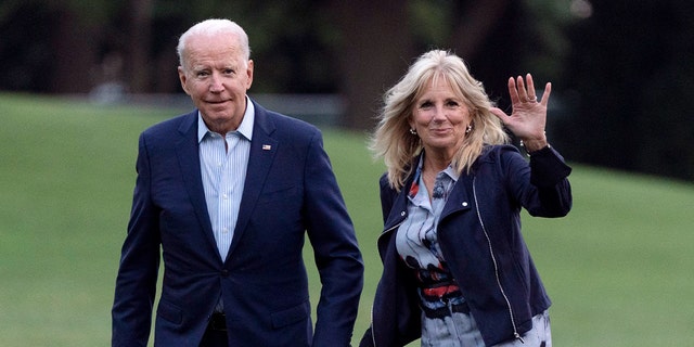President Joe Biden and first lady Jill Biden walk on the South Lawn of the White House after stepping off Marine One on Sunday in Washington. (AP)