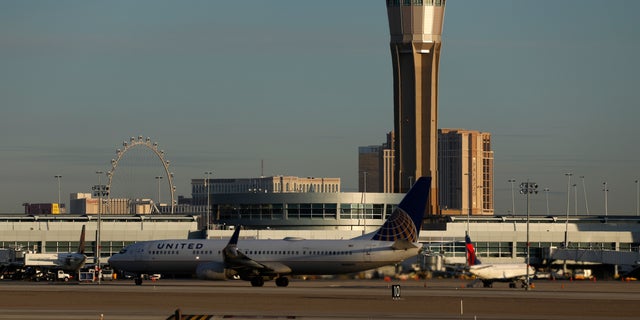 A plane takes off at McCarran International Airport in Las Vegas, March 19, 2020.