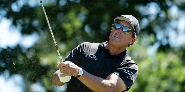 Phil Mickelson watches his shot during the Travelers Championship tournament at TPC River Highlands on June 24, 2021, in Cromwell, Connecticut.