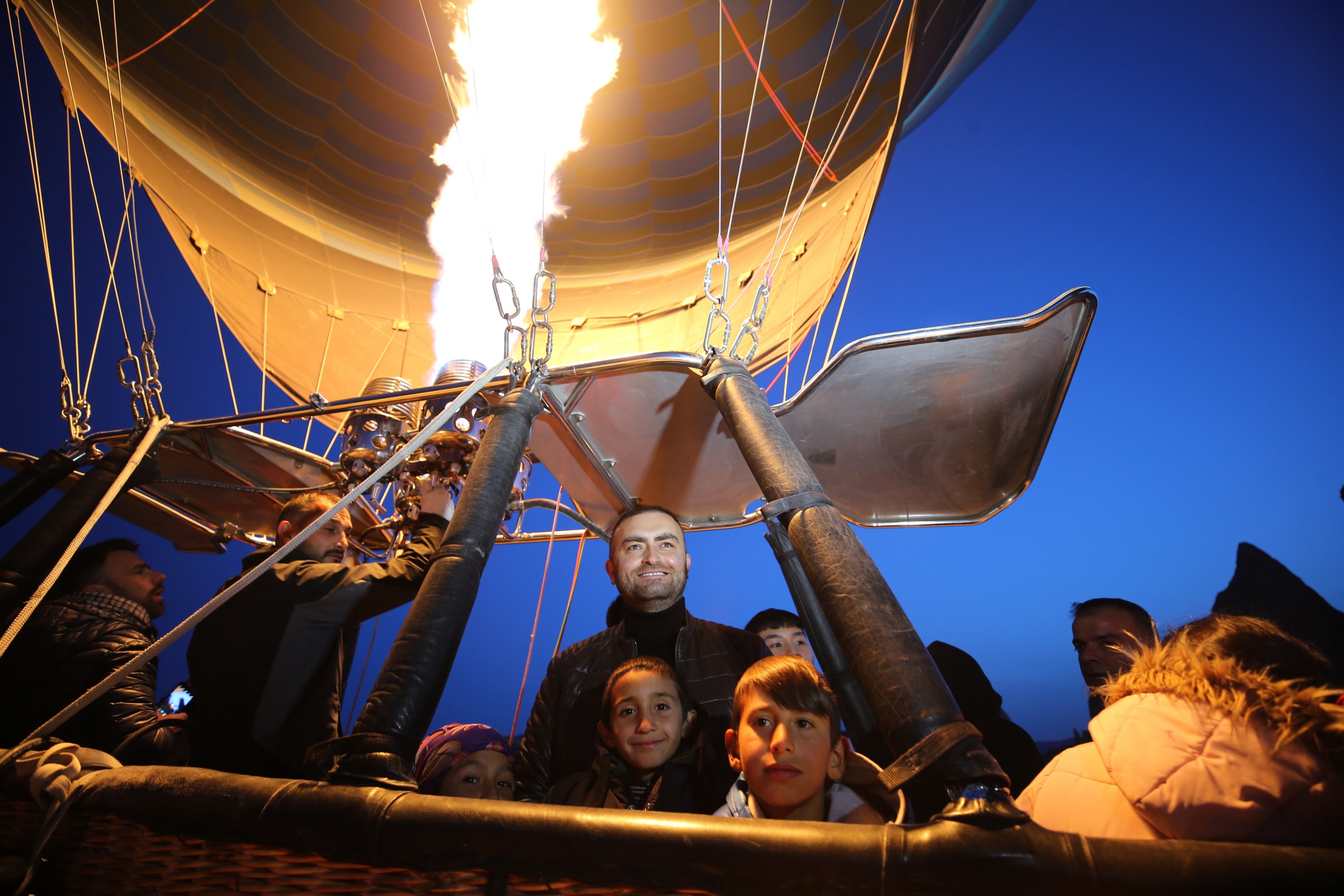 The classroom teacher and his students fly in a hot balloon, Göreme, Cappadocia, Turkey, April 23, 2022. (AA Photo)