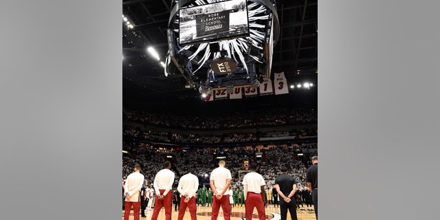 The Miami Heat stand for a moment of silence before Game 5 of the 2022 NBA Eastern Conference finals May 25, 2022, at FTX Arena in Miami, Fla. 