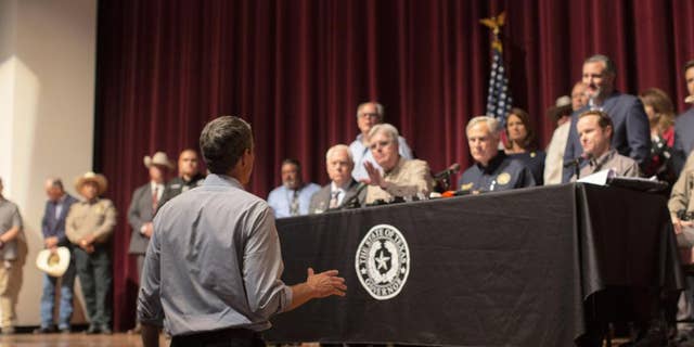 Democrat Beto O’Rourke, who is running against Abbott for governor this year, interrupts a news conference headed by Texas Gov. Greg Abbott in Uvalde, Texas Wednesday, May 25, 2022.