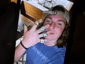 Teenage boy holding up hand with what appear to be professional championship rings on his fingers. (Walton County Sheriffs Office/Facebook)