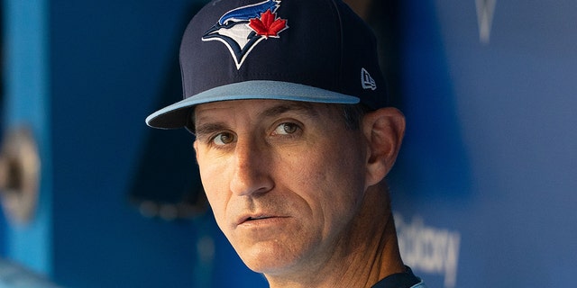 Blue Jays first base coach Mark Budzinski in the dugout before the Oakland Athletics game at Rogers Centre in Toronto on Sept. 3, 2021.