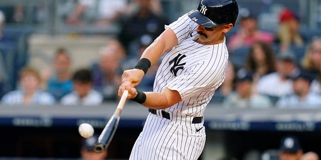 The New York Yankees' Matt Carpenter hits a three-run home run against the Boston Red Sox during the first inning Saturday, July 16, 2022, in New York. 