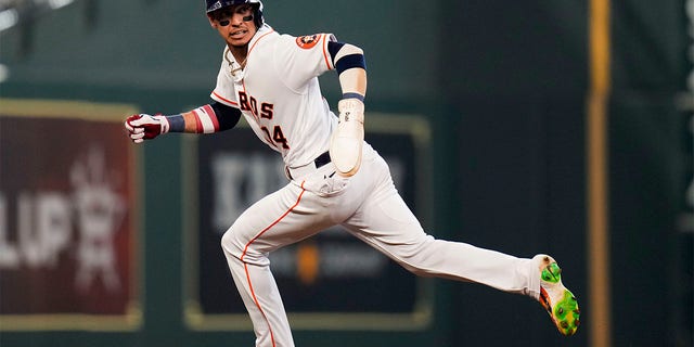 Houston Astros' Mauricio Dubon runs to third after a failed pickoff-attempt of Dubon at first by Kansas City Royals starting pitcher Jonathan Heasley during the fifth inning of a baseball game, Monday, July 4, 2022, in Houston.
