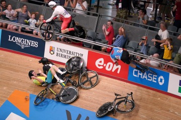 Cyclist flies into crowd & leaves fan covered in blood in Commonwealth smash
