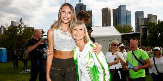 Chloe Lattanzi, left, supported her mother just as much as Olivia Newton-John, right, supported her. They are pictured at a walk in 2019 for Newton-John's cancer research and wellness center in Australia.