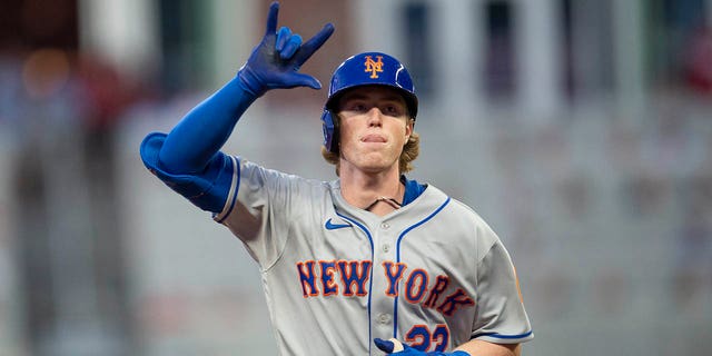 The New York Mets' Brett Baty gestures after hitting a two-run home run in the second inning against the Atlanta Braves Wednesday, Aug. 17, 2022, in Atlanta.
