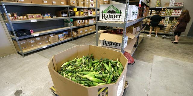 A load of sweet corn sits ready to be given away at the Des Moines Area Religious Council food pantry in Des Moines, Iowa, in July 2015. 