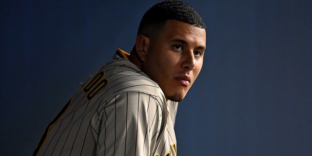 San Diego Padres third baseman Manny Machado, #13, looks on from the dugout during the fifth inning against the Los Angeles Dodgers at Dodger Stadium in Los Angeles Aug. 5, 2022.