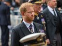 Prince Harry attends the funeral procession for Queen Elizabeth II in London, Monday, Sept. 19, 2022.