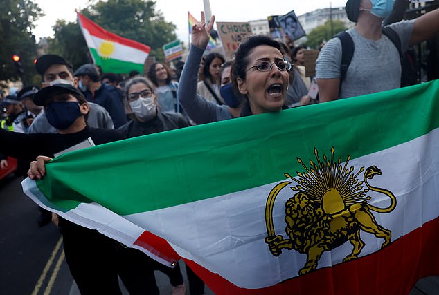 Protestors stand in solidarity with Iranian women after the death of Mahsa Amini, in London, Britain September 24