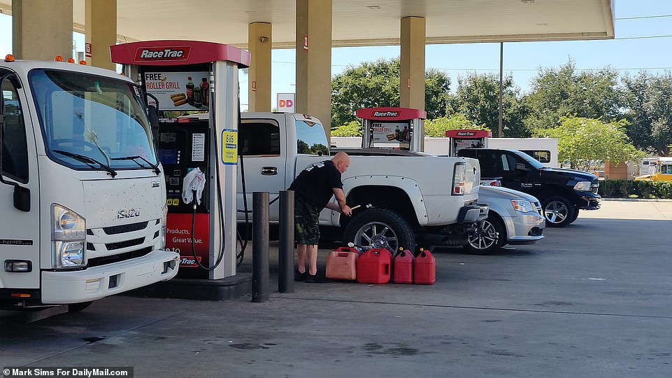 People have been desperate to fill up on gas, causing huge queues at many stations as others are preparing by sandbagging roads outside their properties in an attempt to limit the damage