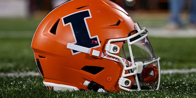 The football helmet of Illinois QB Tommy DeVito, #3, sits on the grass following a college football game between the Chattanooga Mocs and Illinois Fighting Illini on Sept. 22, 2022 at Memorial Stadium in Champaign, Illinois.  