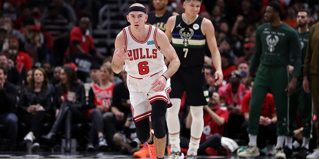 Alex Caruso #6 of the Chicago Bulls reacts to a three point shot during the second quarter of Game Three of the Eastern Conference First Round Playoffs against the Milwaukee Bucks at the United Center on April 22, 2022 in Chicago, Illinois. 