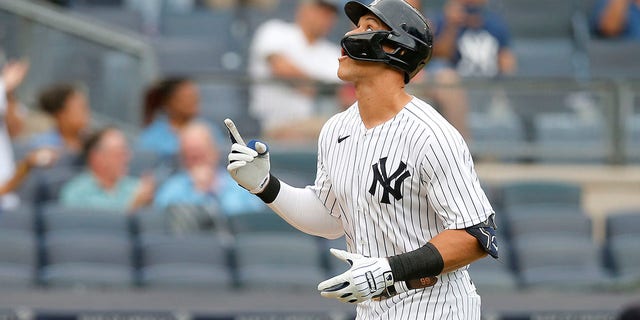 Aaron Judge of the New York Yankees gestures as he runs the bases after his fourth-inning home run against the Minnesota Twins during game one of a doubleheader at Yankee Stadium Sept. 7, 2022, in the Bronx borough of New York City.