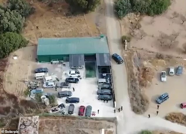 A helicopter circles ahead over a compound as Spanish police cracked down on the cartel