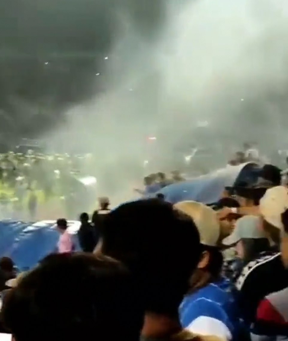 Riot police immediately entered the pitch to confront the football fans and began to fire tear gas indiscriminately