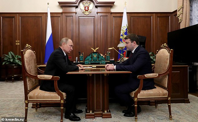 One noted graduate of the HSE is Maxim Oreshkin (right), 40, Putin's (left) own economics adviser, who earlier was his Minister of Economic Development