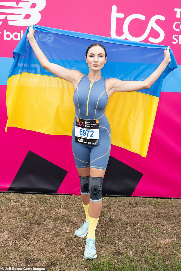 Viktoriya Kiose, 29, ran the gruelling 26.2 miles alongside her fiance Kostiantyn Bidnenko and finished in under four hours