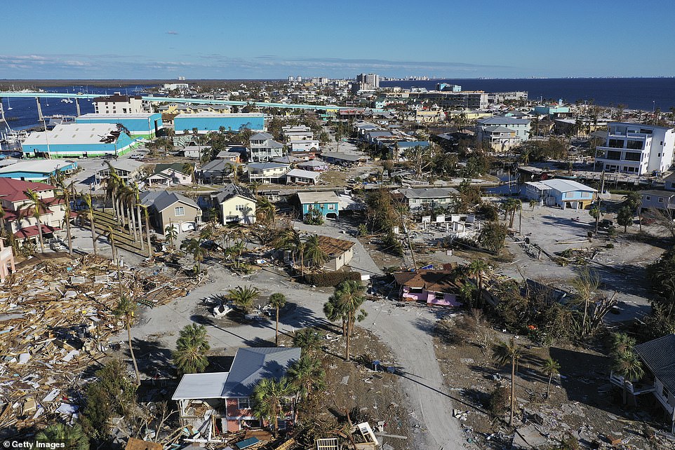 The catastrophic loss documented at Fort Myers Beach, Florida. Roofs have caved in on residents' homes as storm surge submerged the coastland landscape