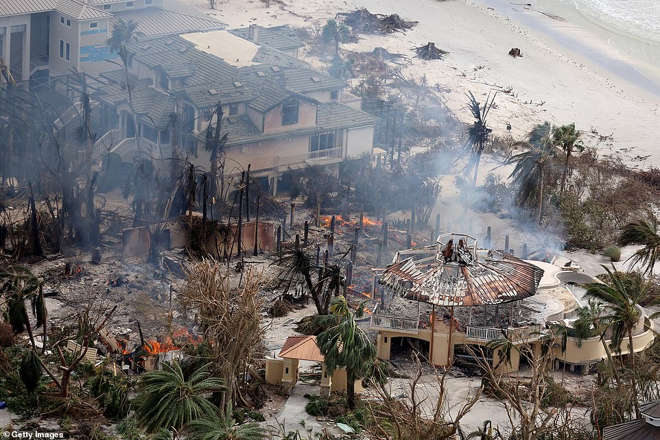 A home burns after Hurricane Ian passed through the area on September 29, 2022 in Sanibel, Florida. Estimations by the insurance industry believe that Ian has caused $60 billion in damage