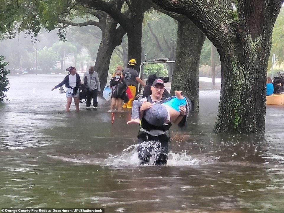 Orange County Fire Rescue Department personnel rescuing flood victims in the wake of Hurricane Ian in Orange County, Florida