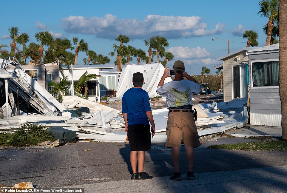 Residents gawk at the damage to their community on Manasota Key in Charlotte County, Florida