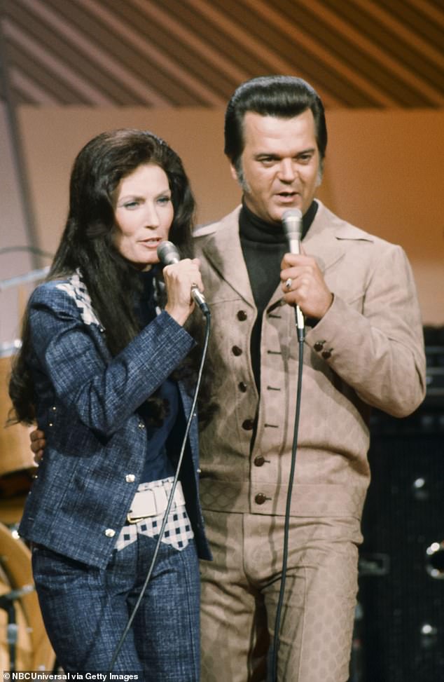 Working relationship: She also teamed up with singer Conway Twitty to form one of the most popular duos in country music with hits such as 'Louisiana Woman, Mississippi Man' and 'After the Fire is Gone,' which earned them a Grammy Award, they are seen in July 1973
