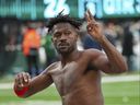 Tampa Bay Buccaneers wide receiver Antonio Brown gestures to the crowd as he leaves the field while his team's offence was on the field against the New York Jets during the third quarter of an NFL football game Sunday, Jan. 2, 2022, in East Rutherford, N.J.