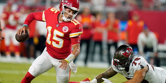 Kansas City Chiefs quarterback Patrick Mahomes (15) scrambles against the Tampa Bay Buccaneers during the first half on Oct. 2, 2022, in Tampa, Florida.