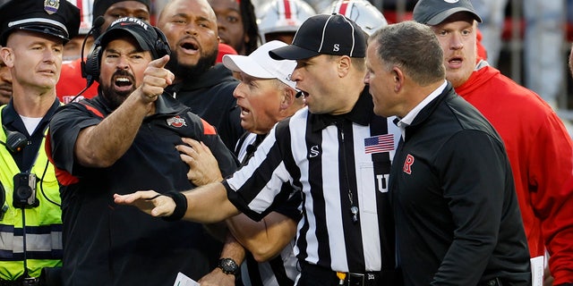 Ohio State head coach Ryan Day, left, argues with Rutgers head coach Greg Schiano during the second half of an NCAA college football game, Saturday, Oct. 1, 2022, in Columbus, Ohio. 