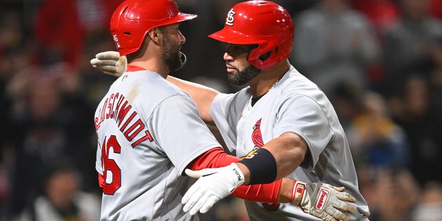 Albert Pujols #5 of the St. Louis Cardinals celebrates his two-run home run with Paul Goldschmidt #46 during the sixth inning against the Pittsburgh Pirates at PNC Park on October 3, 2022 in Pittsburgh, Pennsylvania.