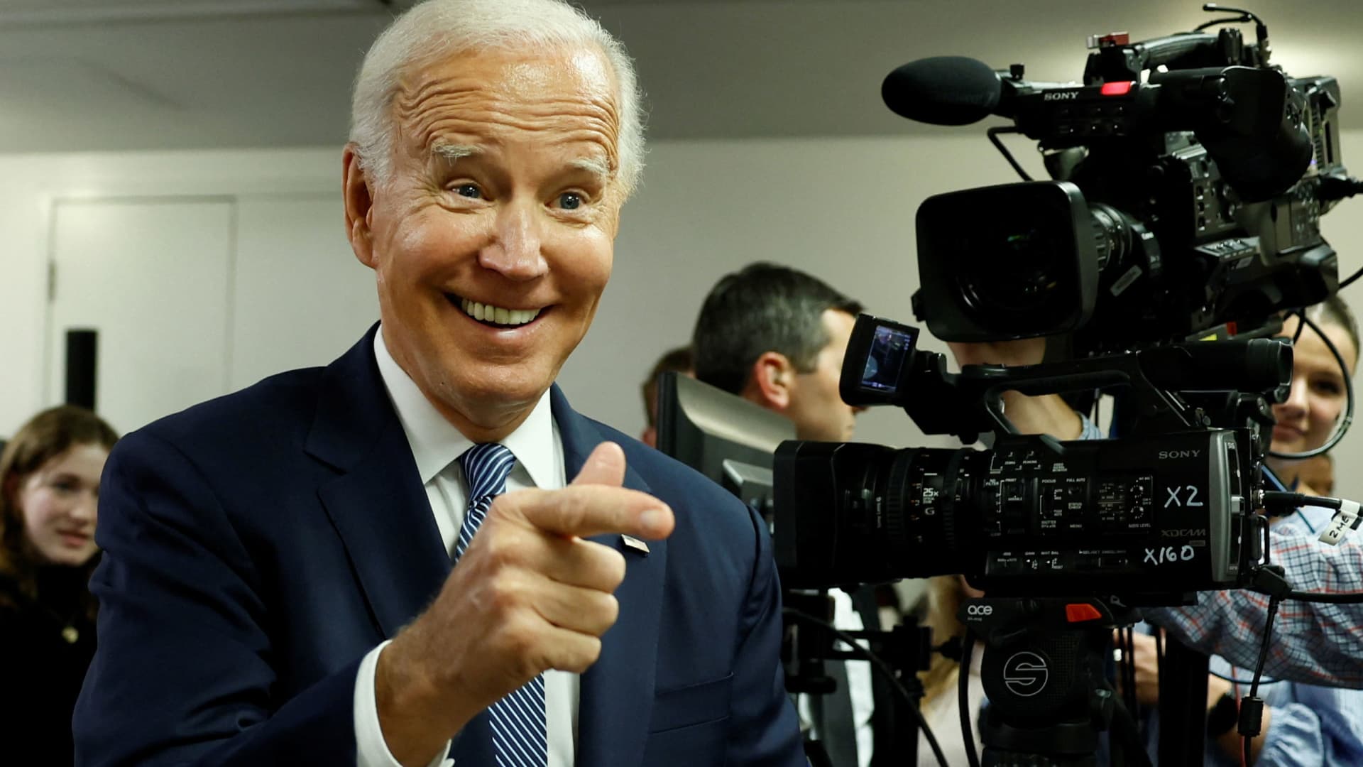 U.S. President Joe Biden laughs at the Democratic National Committee Headquarters ahead of the U.S. mid-term elections, in Washington, October 24, 2022.