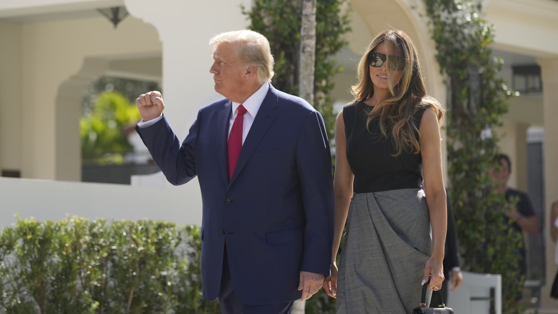 Former President Donald Trump walks out with Melania Trump, after voting at Morton and Barbara Mandel Recreation Center on Election Day, Tuesday, Nov. 8, 2022, in Palm Beach, Fla.
