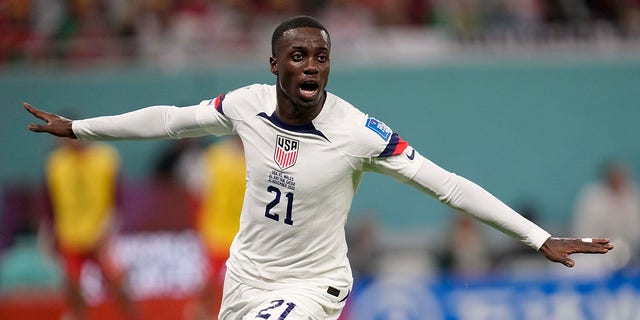 Tim Weah of the United States celebrates after scoring during a World Cup Group B soccer match against Wales at the Ahmad Bin Ali Stadium in Doha, Qatar, Monday, Nov. 21, 2022. 