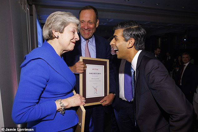 Rishi Sunak shares a laugh with former PM Theresa May at the Spectator magazine's annual awards ceremony last night