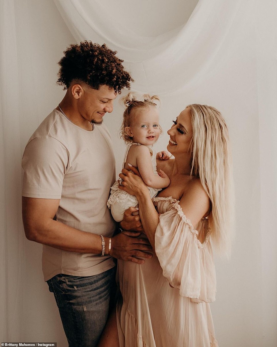 Festive mood: Football star Patrick Mahomes was seen with his pregnant wife as they held their daughter Sterling