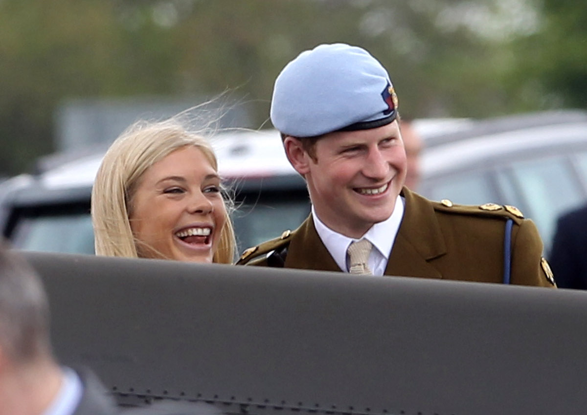 Chelsy Davy, who exhibited signs of 'discomfort' in spotlight where Meghan Markle didn't, according to a body language expert, smiles with Prince Harry