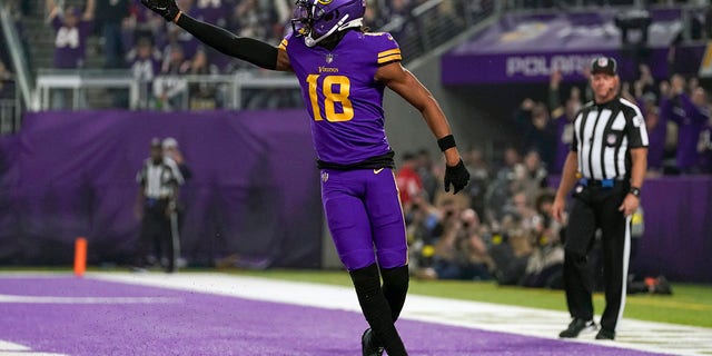 Minnesota Vikings wide receiver Justin Jefferson (18) celebrates his 6-yard touchdown reception by calling for his teammates during the first quarter of a game between the Minnesota Vikings and New England Patriots on November 24, 2022, at U.S. Bank Stadium in Minneapolis, MN.