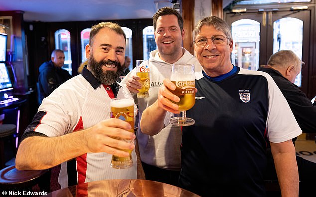 Pictured: (Left to right) Blair Paine, Luke Streeter and Glenn Fisk are preparing for tonight's match vs Senegal at a pub in Croydon