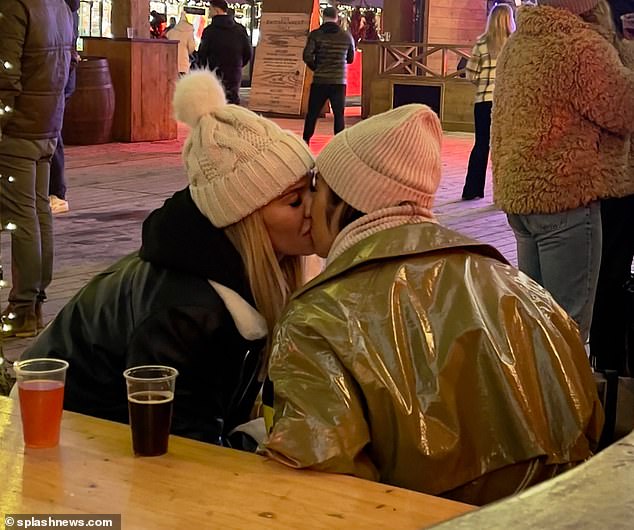 Good pals: Christine McGuinness and her close friend Chelcee Grimes were seen kissing as the enjoyed an evening together at Winter Wonderland in London's Hyde Park this week