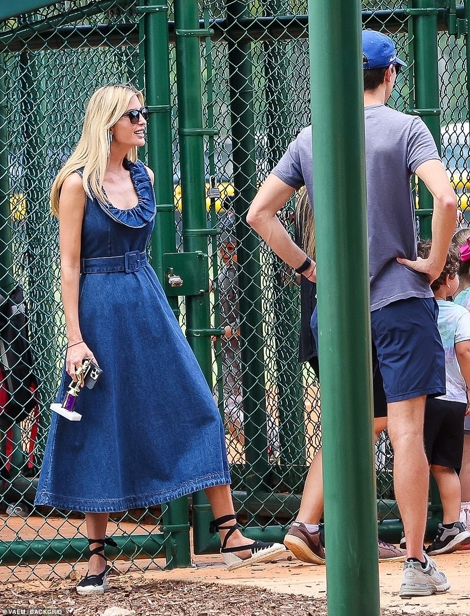 Ivanka elevated her breezy summer dress with a pair of black and cream espadrilles that laced up her ankles