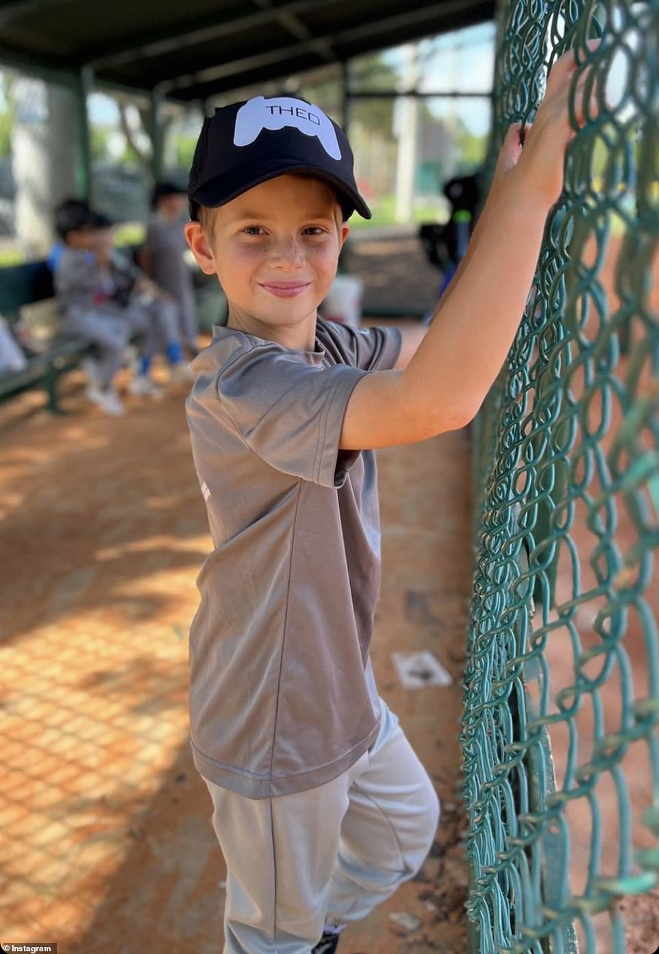 The proud mom also shared a sweet picture of Theo smiling in the dugout, his hands resting on the green chain link fence