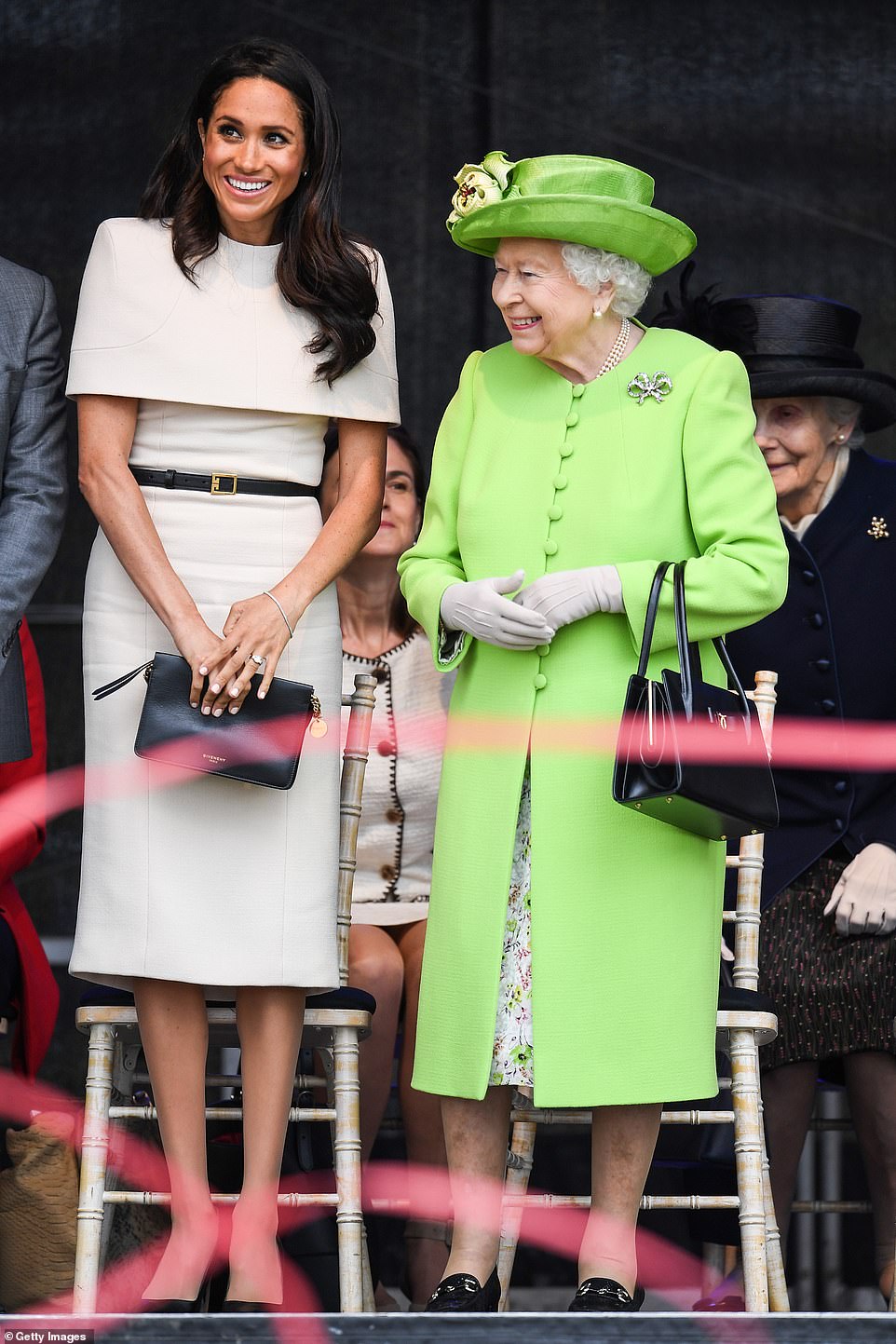 Many associated with the Royal Household were also deeply upset at the depth of the couple¿s ¿shameful and cowardly¿ betrayal of the late Queen. Meghan is pictured with the Queen in Chester in 2018
