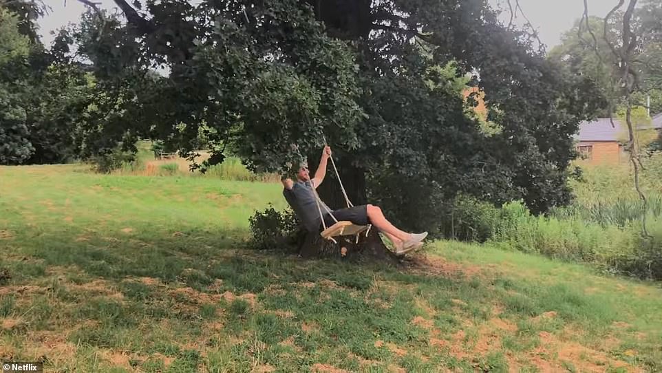 Prince Harry is seen swinging from a tree in the grounds of the cottage in one scene