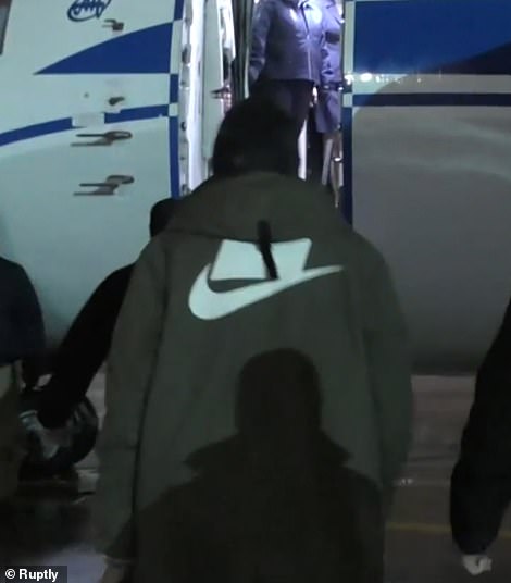 Griner is shown boarding a plane to leave Russia today after being swapped for Viktor Bout