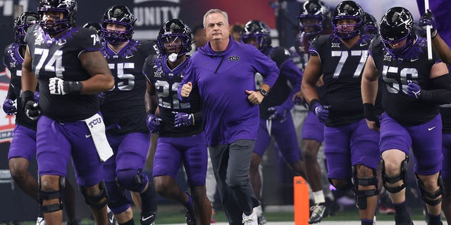 TCU head coach Sonny Dykes leads his team onto the field for the Big 12 Championship Game between the TCU Horned Frogs and the Kansas State Wildcats on December 03, 2022, at AT&amp;T Stadium in Arlington, Texas.