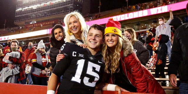 Iowa State Cyclones quarterback Brock Purdy, #15, celebrates with his mother Carrie Purdy, left, and sister Whitney Purdy after winning 37-30 over the Oklahoma Sooners at Jack Trice Stadium on Oct. 3, 2020 in Ames, Iowa.